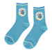 Pair of blue socks with floral designs on a light gray background