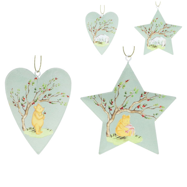 Four decorative hanging ornaments shaped like a heart, a star, and two small heart/star forms, featuring a pastel illustration of Winnie the Pooh under a flowering tree on a pale mint background.