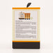 The back of a rectangular bath and body wash package, showing product information, a small product illustration with three orange tubes, and a black pull tab at the top, photographed on a clean white background.