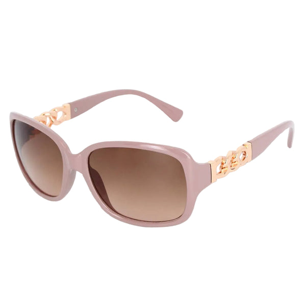 Pink sunglasses with gold accents on a light gray background