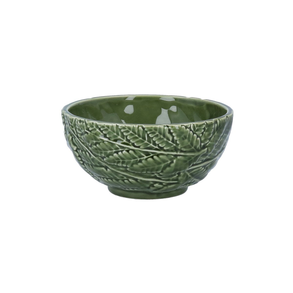 Green ceramic bowl with leaf pattern on a white background