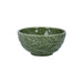 Green ceramic bowl with leaf pattern on a white background