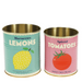 Two tin cans labeled 'Moroccan Lemons' and 'Spiced Tomatoes' on a green background