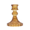 Decorative amber glass candle holder on a white background