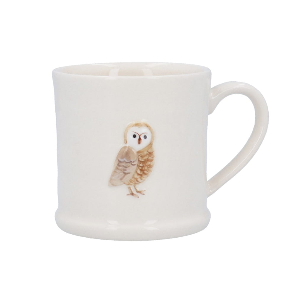 White mug with an owl design on a white background
