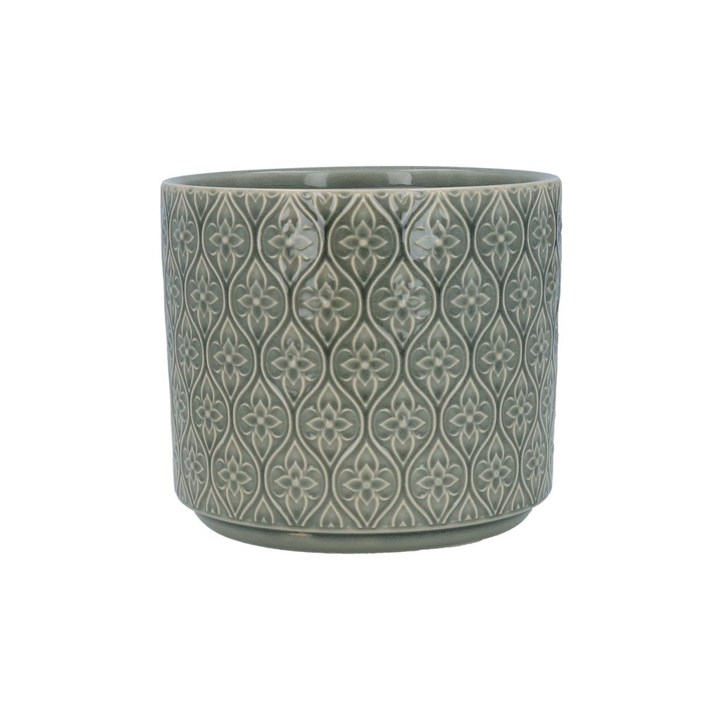 Green ceramic pot with decorative pattern on a white background