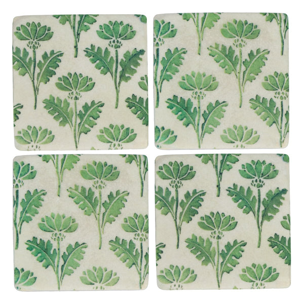Four square coasters with green leaf pattern on a white background