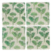 Four square coasters with green leaf pattern on a white background