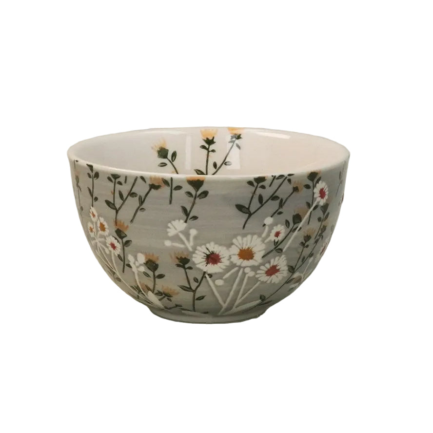 Ceramic bowl with floral pattern on a light white background