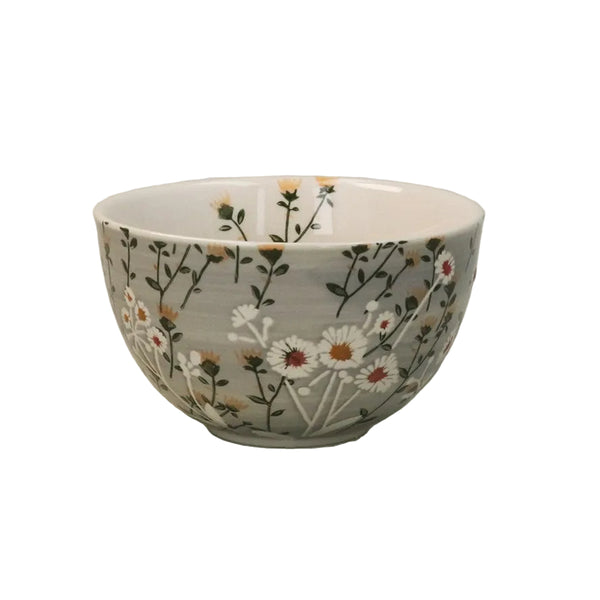 Ceramic bowl with floral pattern on a light white background