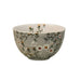 Ceramic bowl with floral pattern on a light white background