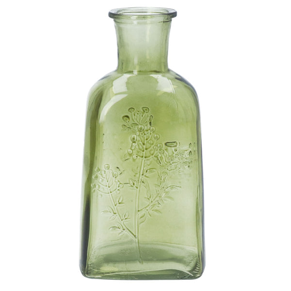 Green glass bottle with floral embossing on a white background