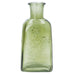 Green glass bottle with floral embossing on a white background