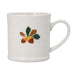 White mug with acorn and leaf design on a white background