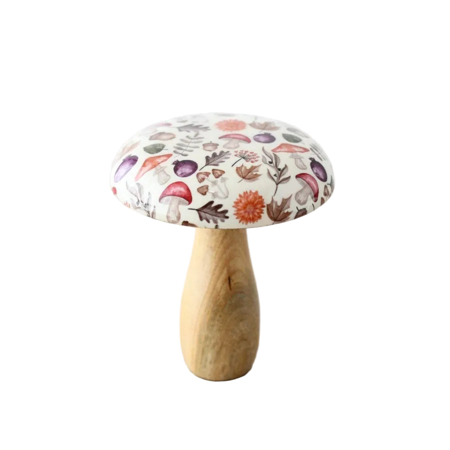 A mushroom-shaped decorative object with a light wood stem and a white fabric cap printed with a multicolor botanical mushroom pattern, standing on a light wood surface against a white background.
