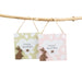 Two Easter-themed cards with bunnies and hearts hanging from a branch.