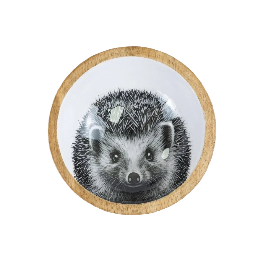 Round wooden coaster with a badger illustration on a wooden surface