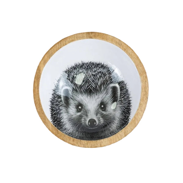 Round wooden coaster with a badger illustration on a wooden surface