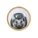 Round wooden coaster with a badger illustration on a wooden surface