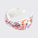 A wide fabric headband with a colorful paisley and floral print on a white base, featuring a solid white inner lining and a white adjustable tail tab, shown on a light gray background.