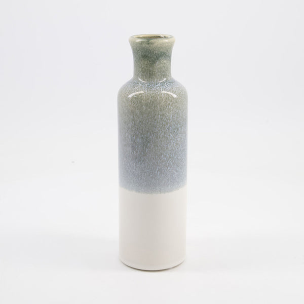 A small ceramic vase with a textured, speckled glaze that transitions from a muted sage green at the top to a soft blue-gray in the middle, and finishes with a smooth, matte off-white base.