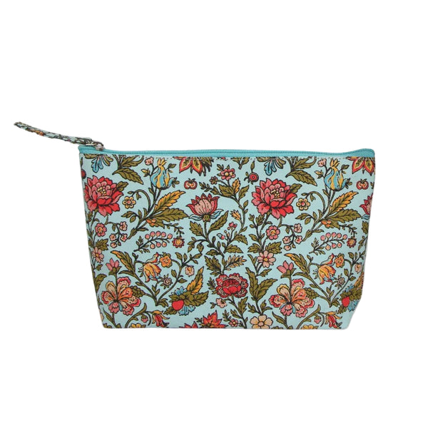 Floral patterned pouch on a light blue background