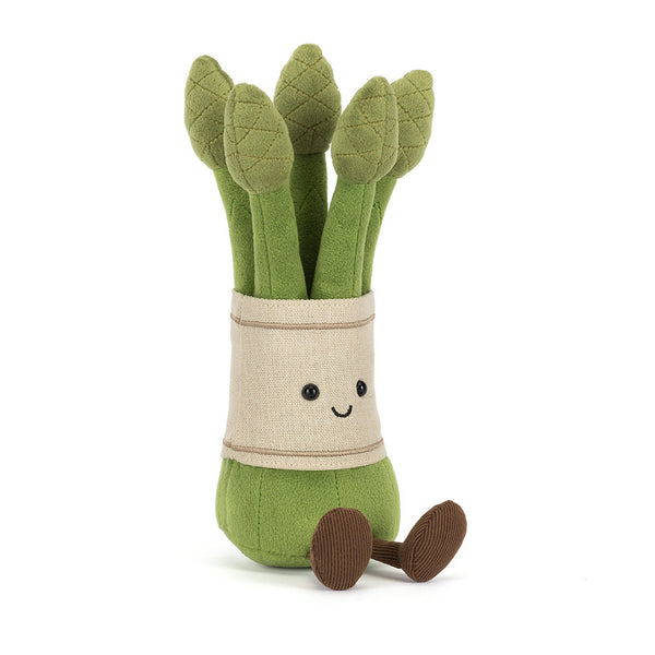 Plush toy asparagus with a smiling face on a white background