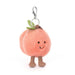 Plush peach character keychain with a white background