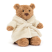 Plush teddy bear wearing a cream robe on a white background
