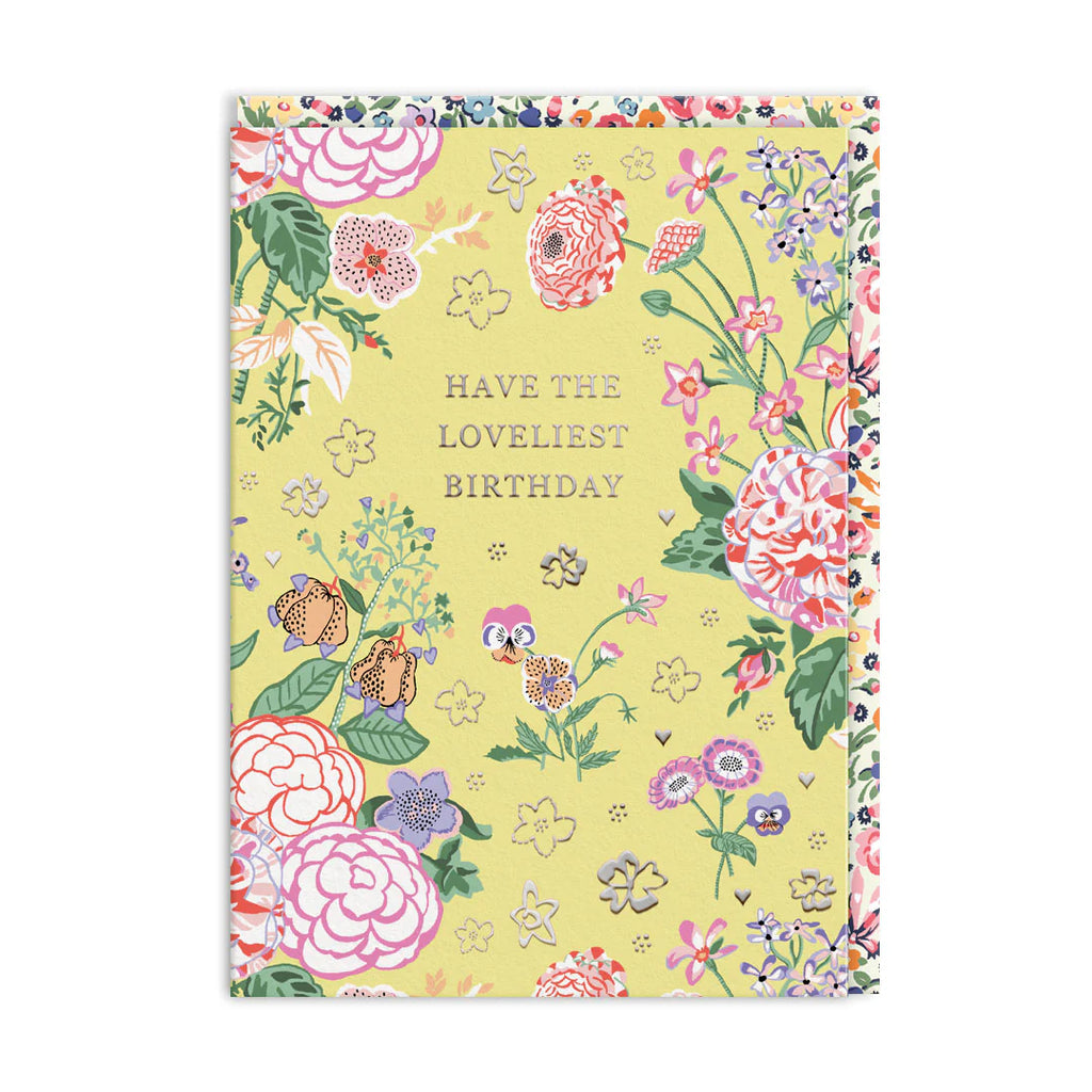 Floral birthday card with colorful flowers and text on a yellow background