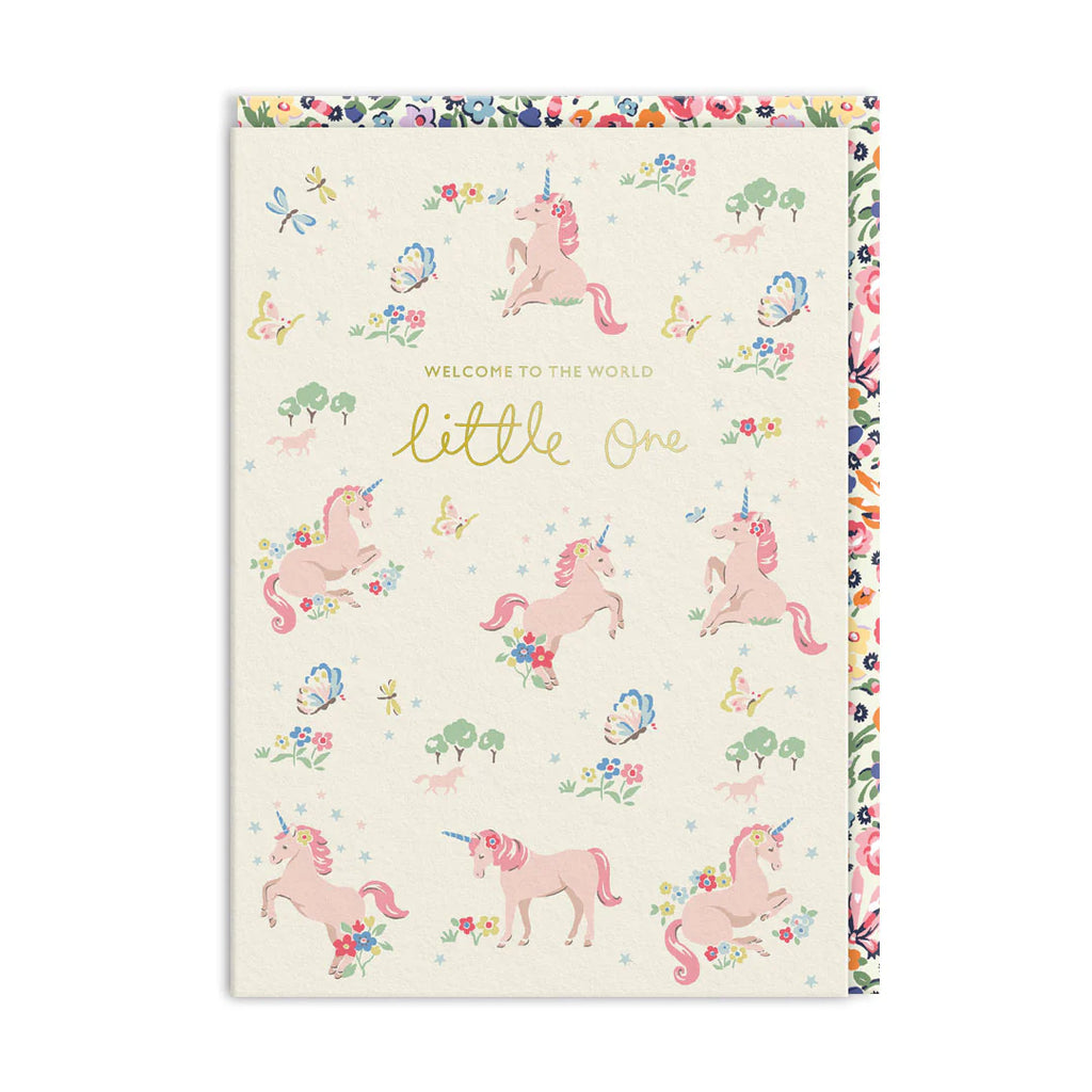 Greeting card with pink unicorns and floral patterns on a white background