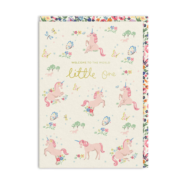 Greeting card with pink unicorns and floral patterns on a white background