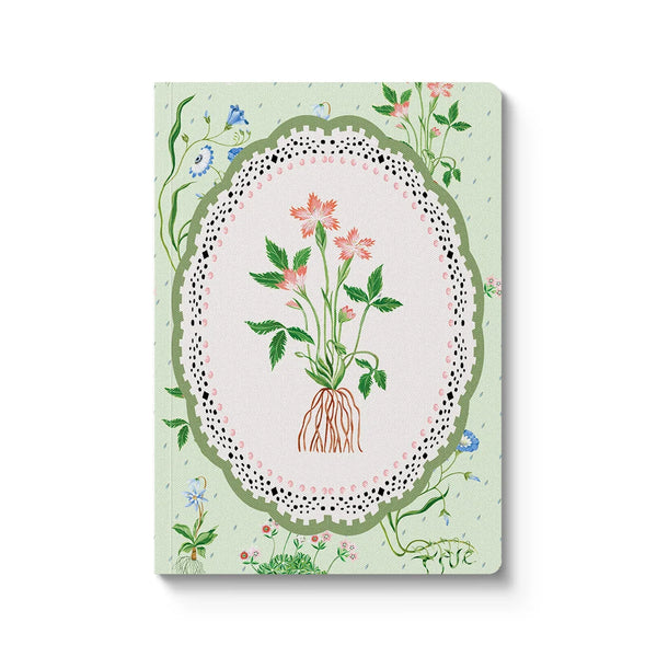 Notebook with floral design on a light green background