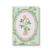 Notebook with floral design on a light green background