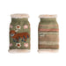 Two knitted dog sweaters with floral and patterned designs on a white background