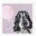 Birthday card with a dog illustration and pink balloon on a light purple background
