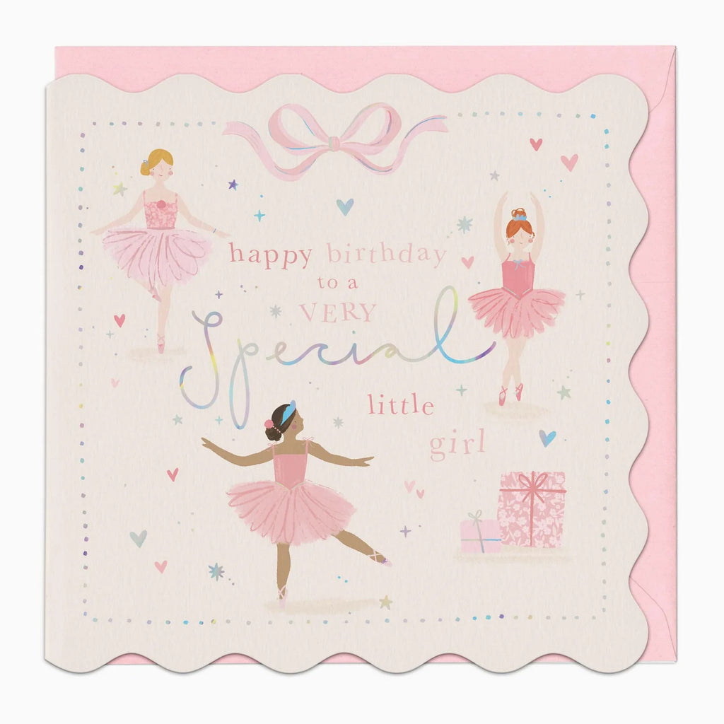 A scalloped-edge birthday card with ballerina illustrations and the text 'happy birthday to a very special little girl,' shown with a pink envelope behind it on a light gray background.