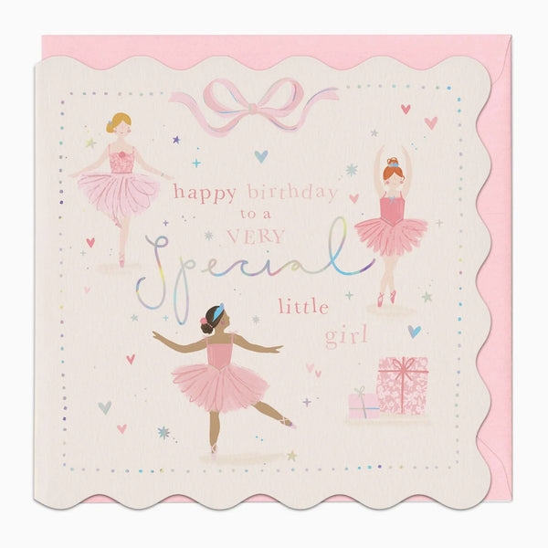 A scalloped-edge birthday card with ballerina illustrations and the text 'happy birthday to a very special little girl,' shown with a pink envelope behind it on a light gray background.