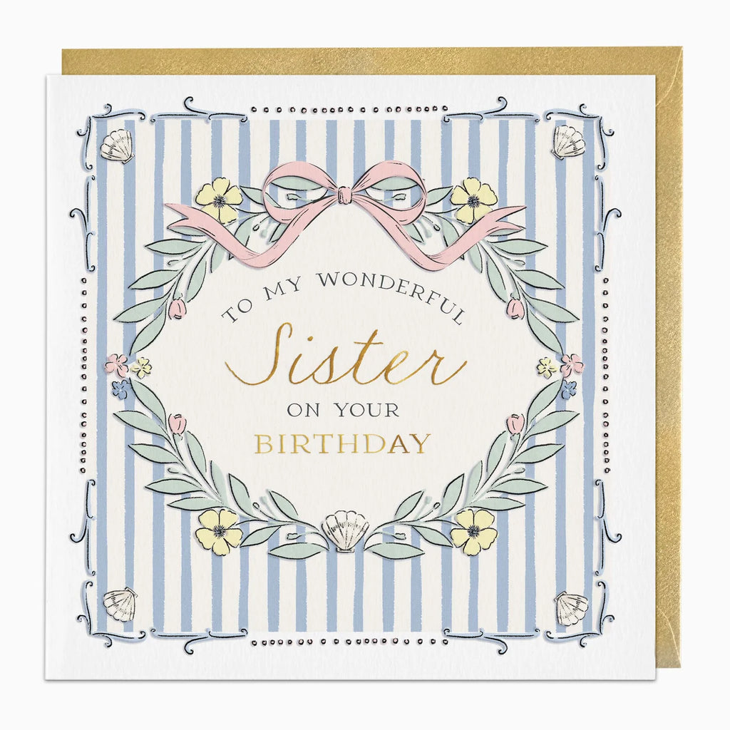 A square birthday card with a gold envelope behind it. The card has a white border, light blue vertical stripes, and a central cream circle with the text 'TO MY WONDERFUL Sister ON YOUR BIRTHDAY' in black and gold script.