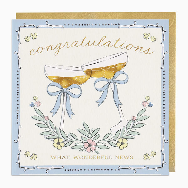 A square congratulations greeting card with a light blue border, gold script text reading 'congratulations' and 'WHAT WONDERFUL NEWS,' and an illustration of two champagne glasses tied with pale blue bows, shown with a gold envelope behind it.