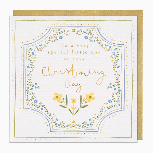 A square Christening Day greeting card with a gold envelope behind it. The card has a white background with a decorative floral border in blue, yellow, and green, and gold text reading 'To a very special little one on your Christening Day'.
