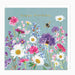 Greeting card with colorful floral design and 'happy birthday' text on a light blue background.