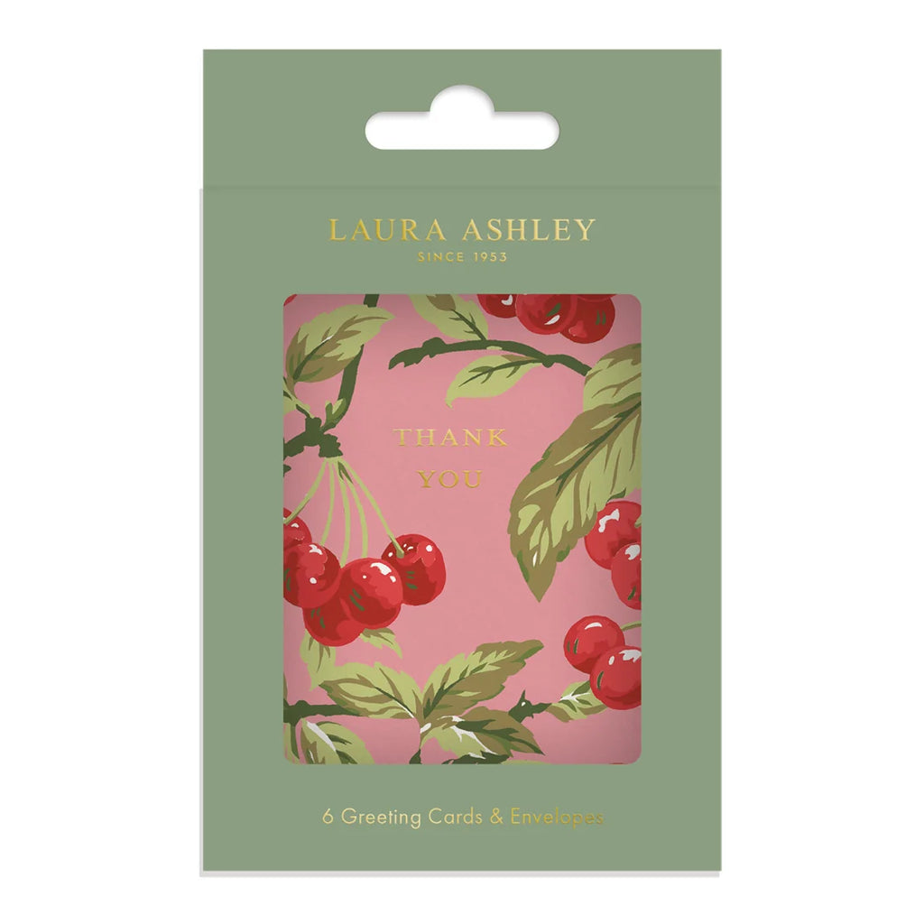 Laura Ashley Thank You greeting card set in its original sage green packaging, featuring a pink card with a red cherries and green leaves illustration.