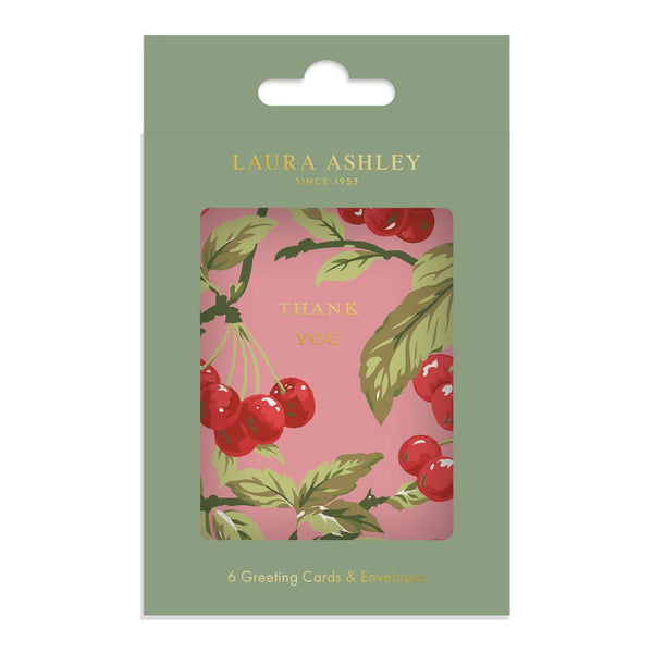 Laura Ashley Thank You greeting card set in its original sage green packaging, featuring a pink card with a red cherries and green leaves illustration.