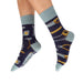 Navy blue socks with tool patterns worn by a person on a white background