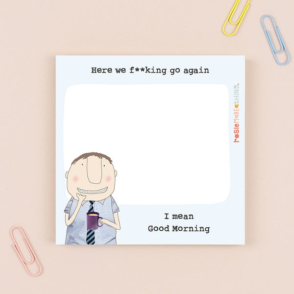 Cartoon character with text on a card, surrounded by paper clips on a beige background