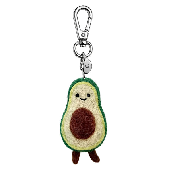 Avocado-shaped keychain with a smiling face on a white background