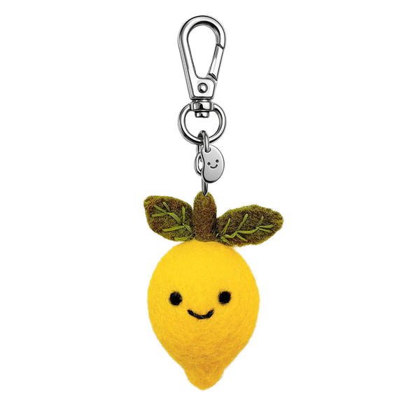 Plush lemon keychain with a smiling face on a white background