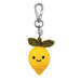 Plush lemon keychain with a smiling face on a white background