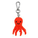 Red octopus keychain with a smiling face on a white background